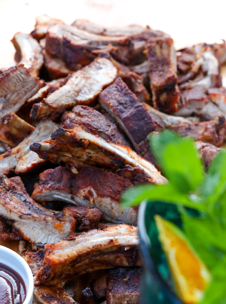 grilled baby back ribs on cutting board