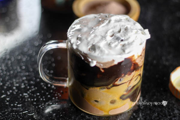 Curl up this fall with this delicious Pumpkin flavored hot chocolate. Pumpkin Spiced & Iced Cocoa with Roasted Marshmallow Creme