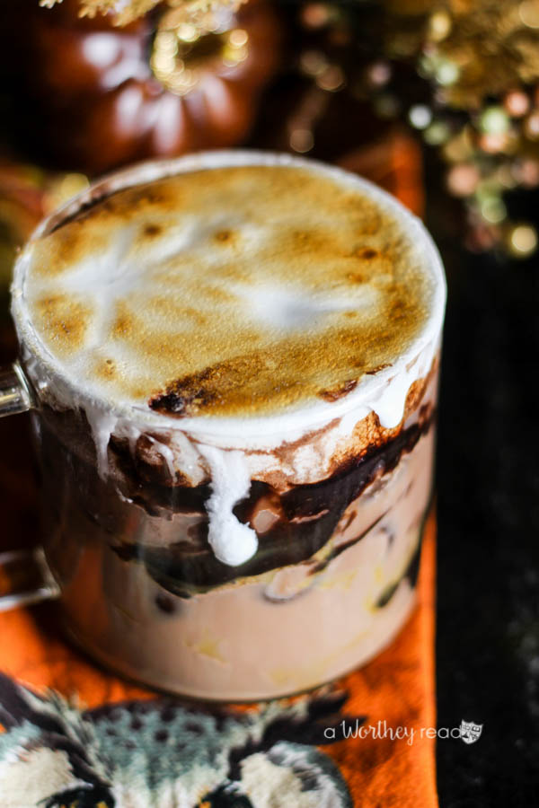 Curl up this fall with this delicious Pumpkin flavored hot chocolate. Pumpkin Spiced & Iced Cocoa with Roasted Marshmallow Creme