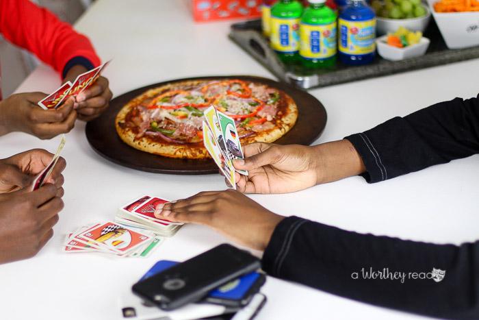 As kids grow older, they may not always want to do things with their parents. If you're struggling to find ways to engage your teens in game night, I'm sharing tips on engaging your teens. Family Game night is a great way to put down the devices and engage the whole family into connecting with each other.