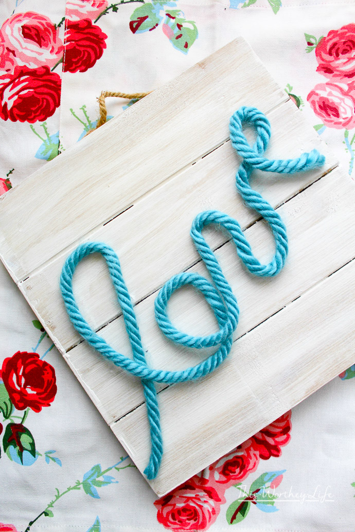 Here's a quick DIY you can do for Valentine's Day. With a piece of reclaimed wood, paint, and a few other accessories to put together this DIY Love Rope Sign.
