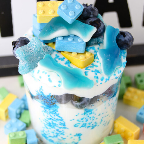 Create a fun and healthy snack for the kids. This lego + blue shark parfait is a fun treat any child will enjoy. Lego toys are super popular with kids, and so will this lego food recipe idea! It's a great lego birthday snack, or to serve during shark week! 
