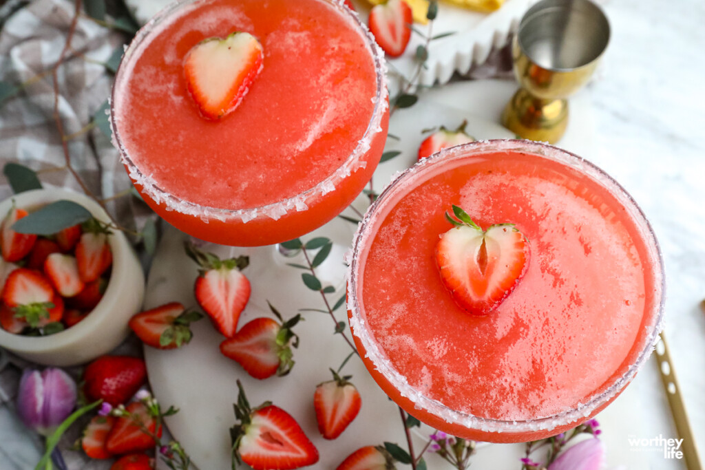 two frozen strawberry margaritas