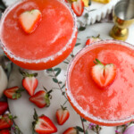 two frozen strawberry margaritas