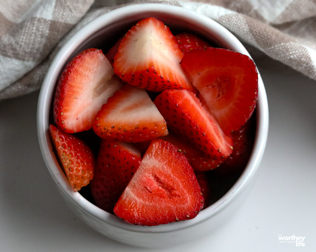 fresh strawberries in a white bowl