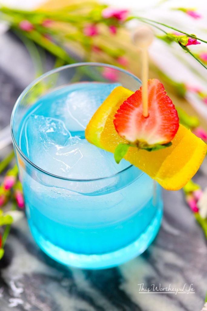 Toast to Marvel's Black Panther movie with our Vibranium cocktail made with hpnotiq liqueur. This hpnotiq drink is a beautiful, pastel blue drink- perfect to serve at any party. Cheers to Marvel's Black Panther movie, featuring a black superhero!