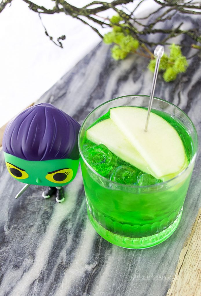 We're dedicating this green apple vodka to Gamora, first seen in Guardians of the Galaxy. Gamora plays an important role in Infinity War, and we get to see quite a bit of dialogue between Gamora and Thanos. This Honeycrisp vodka mixed with&nbsp;Midori Melon and green apple soda pays homage to Gamora.