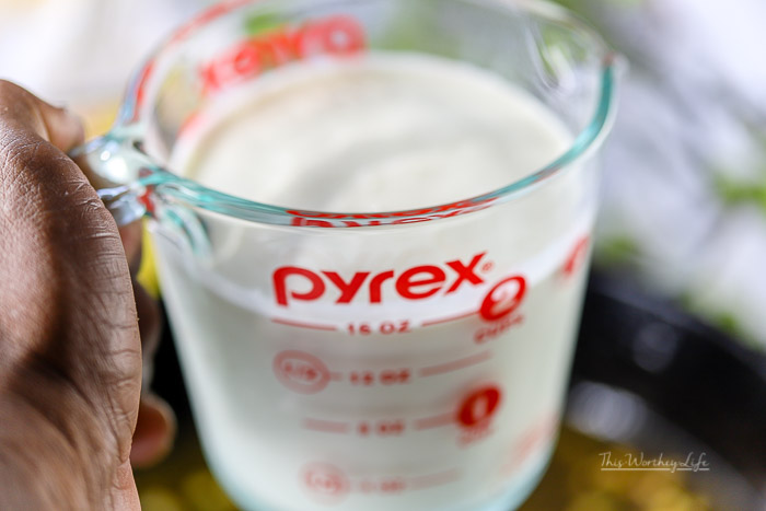 2 cups of heavy whipping cream in a measuring glass