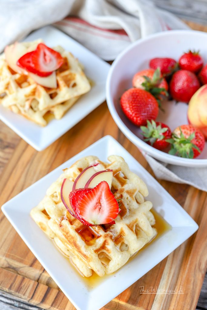 Use our breakfast hack on making "homemade" waffles with pancake mix. With fresh fruit such as strawberries and white peaches, this easy waffle recipe can be made in just a few minutes, which is perfect for those busy school mornings. Easy Waffle Recipe | Strawberry + White Peach Waffles