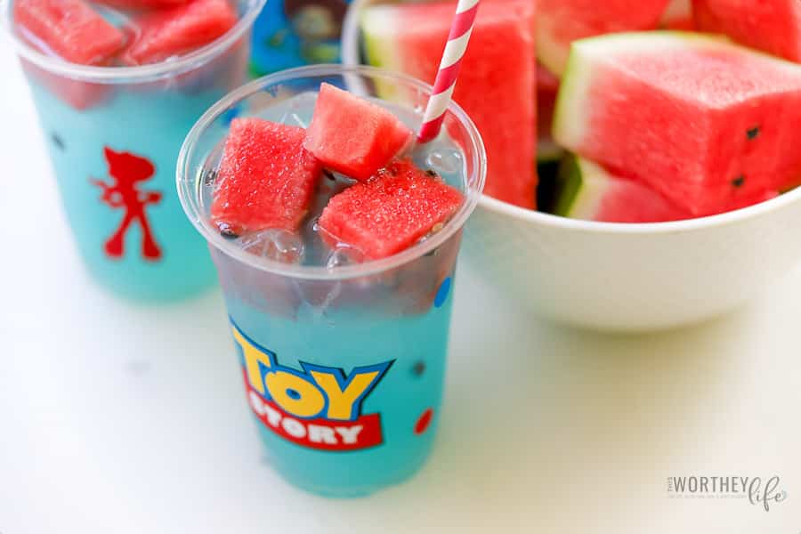 blue lemonade in a toy story cup with cubed watermelon