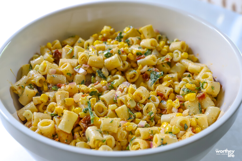 mexican street corn pasta salad in a large mixing bowl