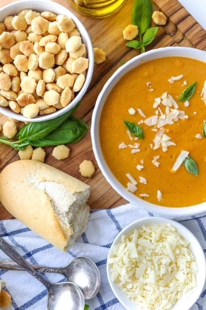 crab bisque in a white bowl on a dark background