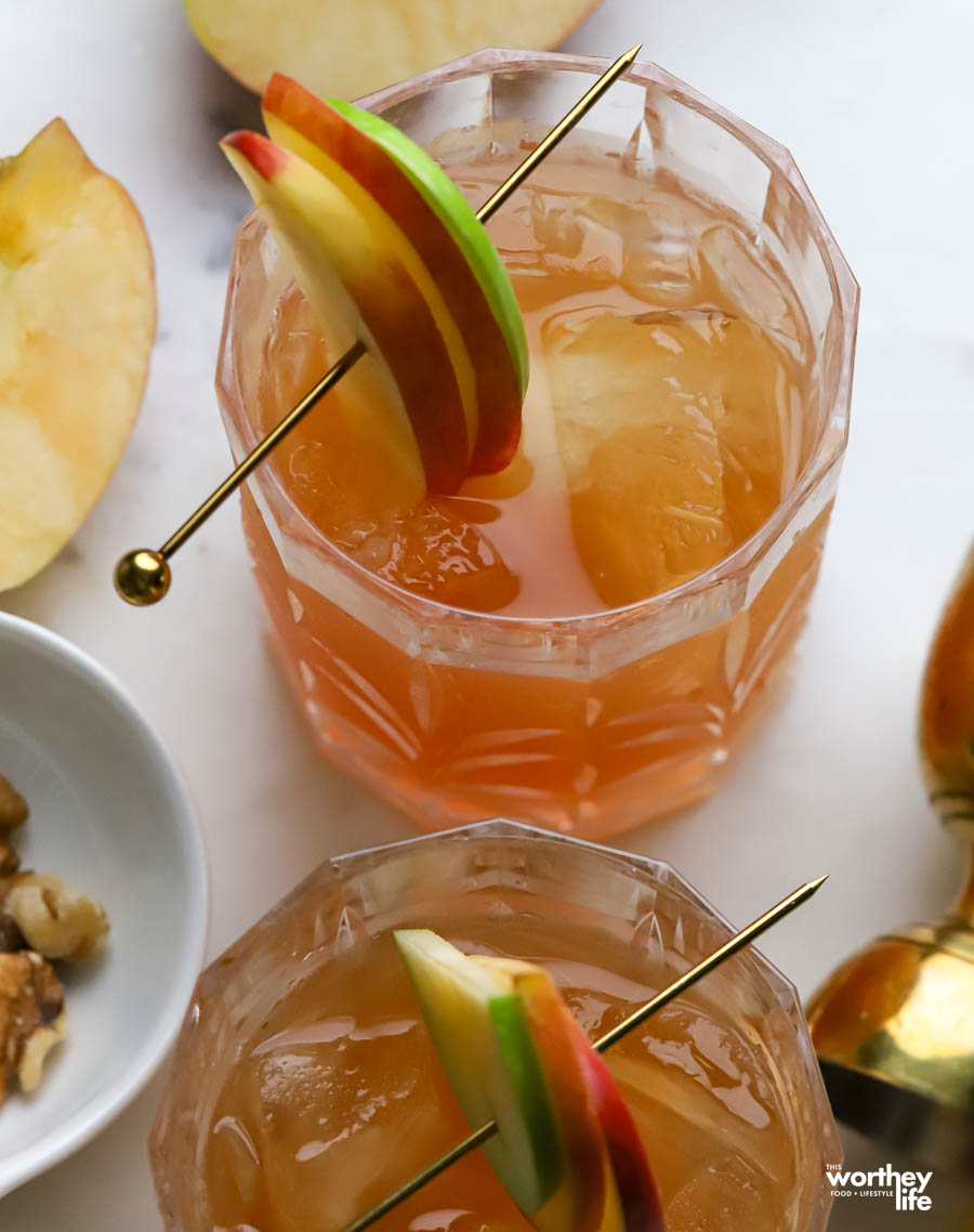 one glass with a bourbon punch on a marble background