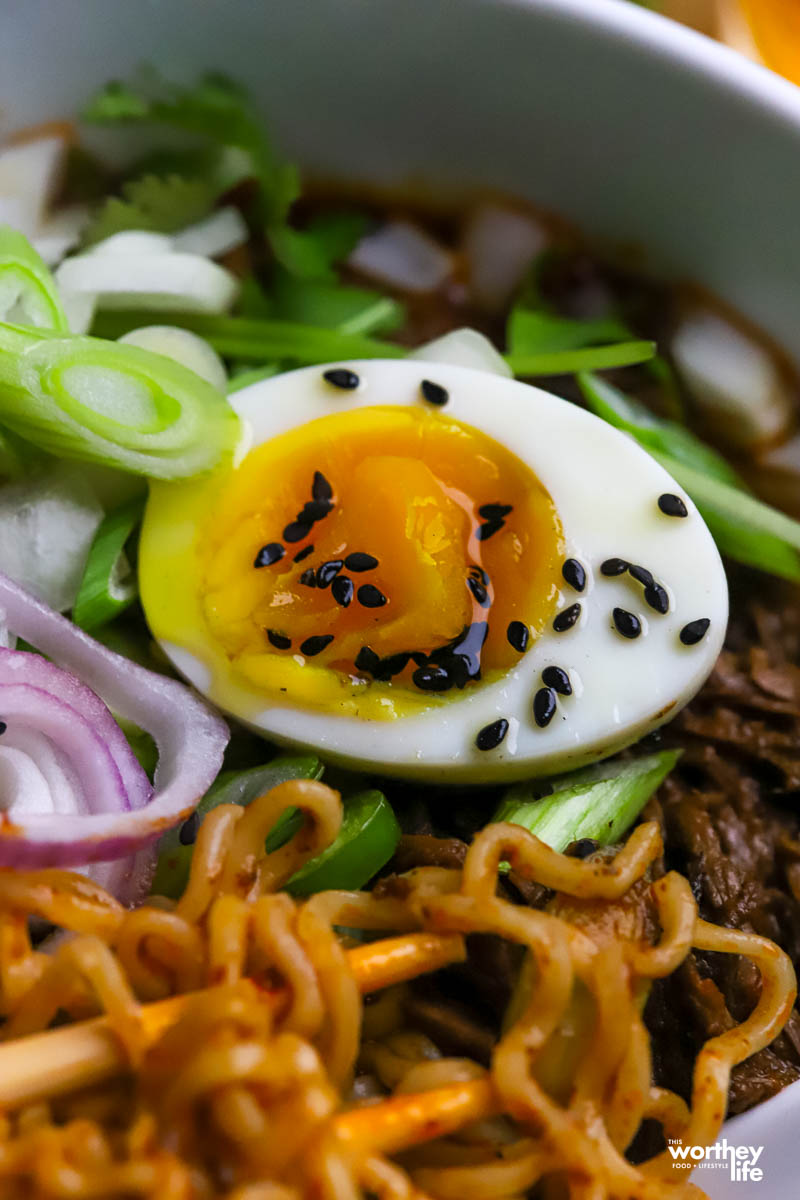 traditionally a soft boiled eggs is served with ramen.