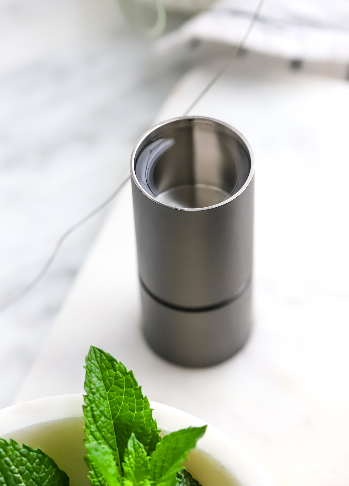 A jigger filled with tequila.