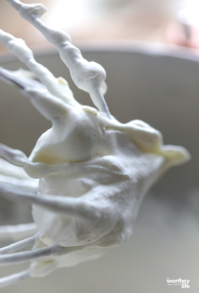 Billowing whipped cream on a wire whisk attachment.