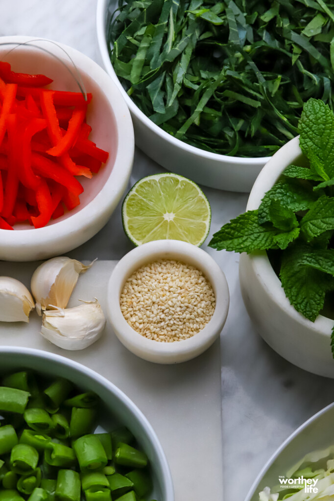 Ingredients for making our Thai Cabbage Salad in various white containers.