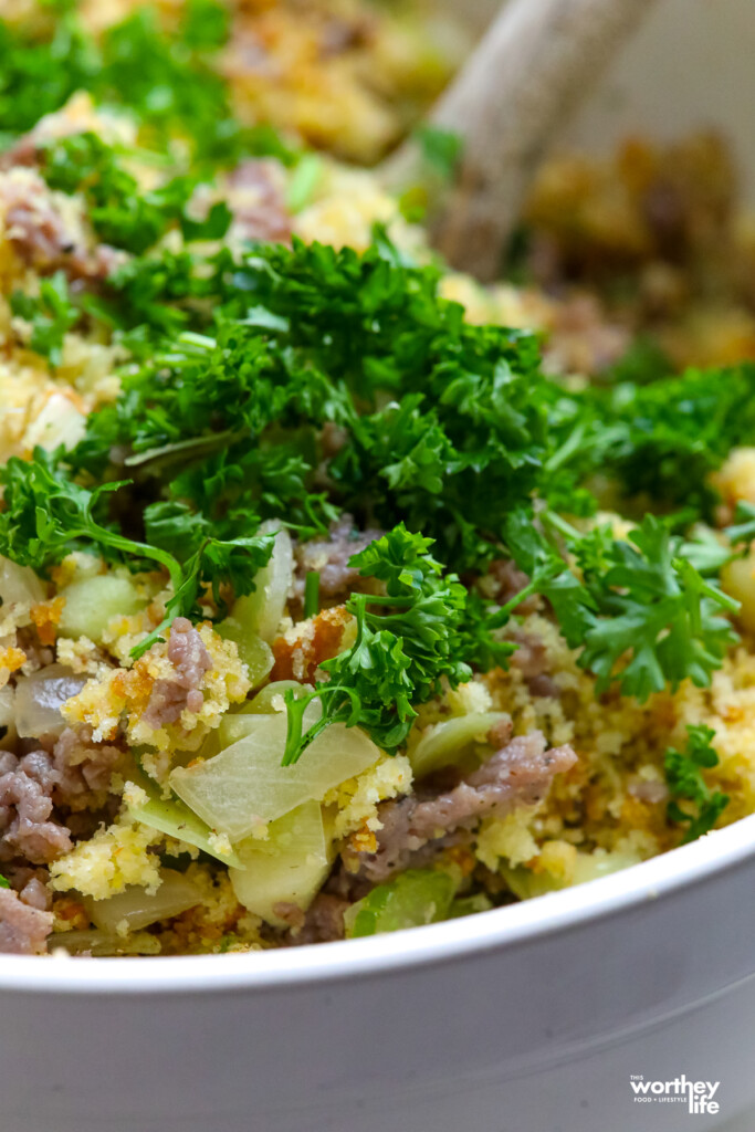 adding ingredients to make a dressing recipe for thanksgiving