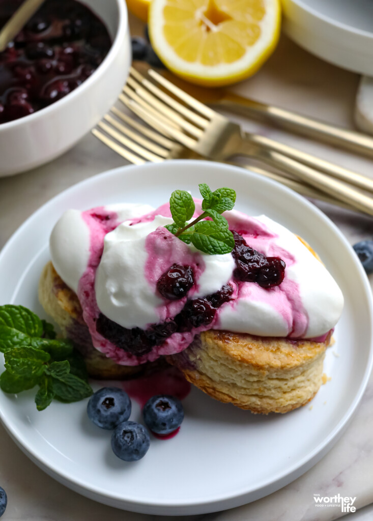 a summer dessert with berries, whipped cream