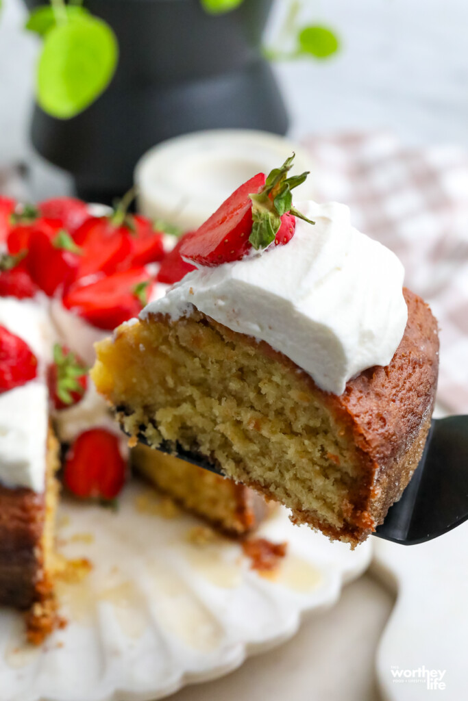 a slice of olive oil cake on a marble platter