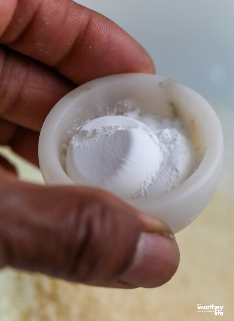 holding baking soda and baking powder in a marble holder