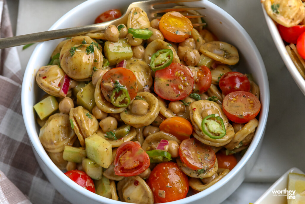 fresh pasta salad in a white bowl