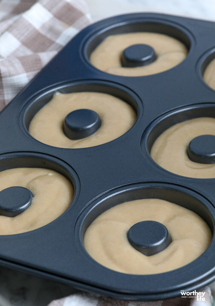 apple cider donut batter in a donut pan