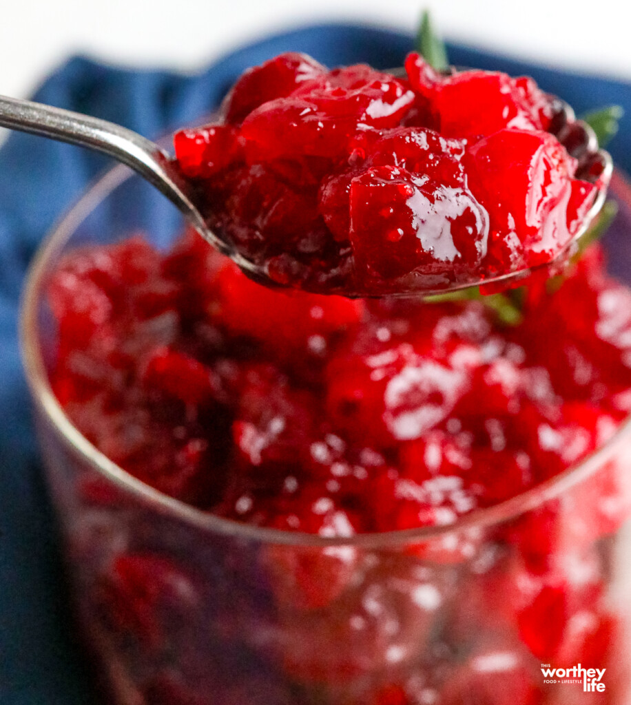 spooning homemade whole berry cranberry sauce