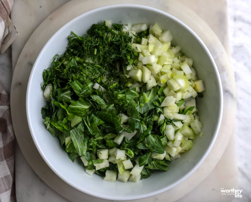a bowl of fresh veggies, fennel, cilantro