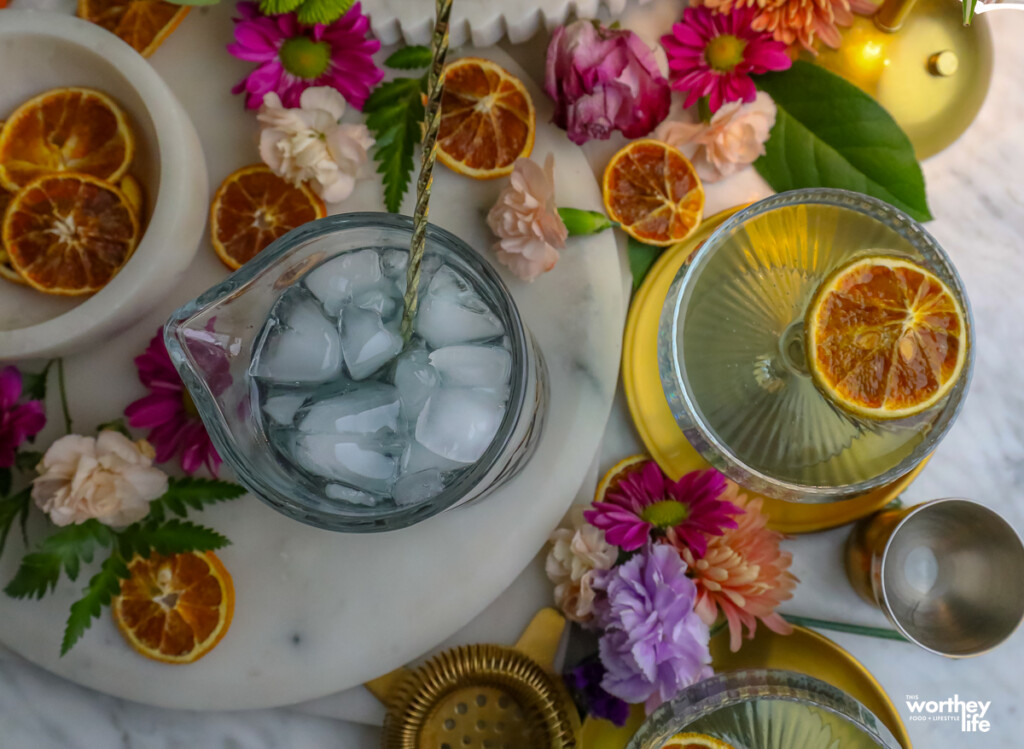floral gin cocktail surrounded by flowers