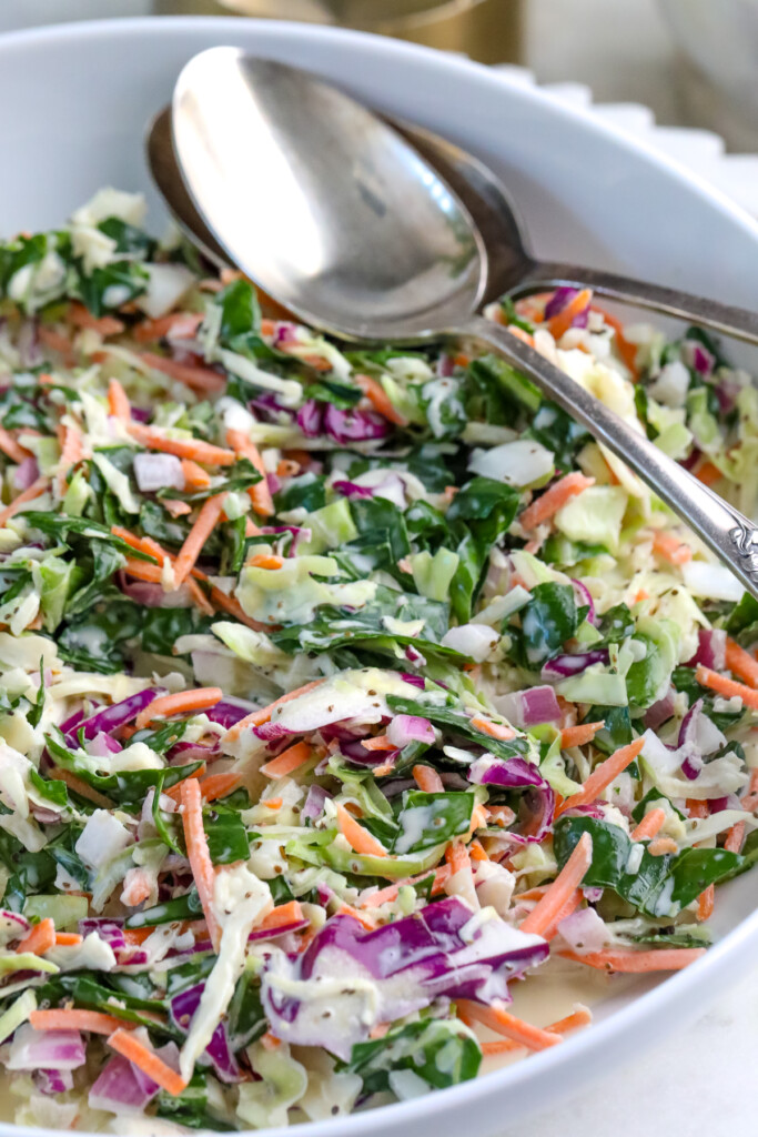summer collard coleslaw in a large white bowl