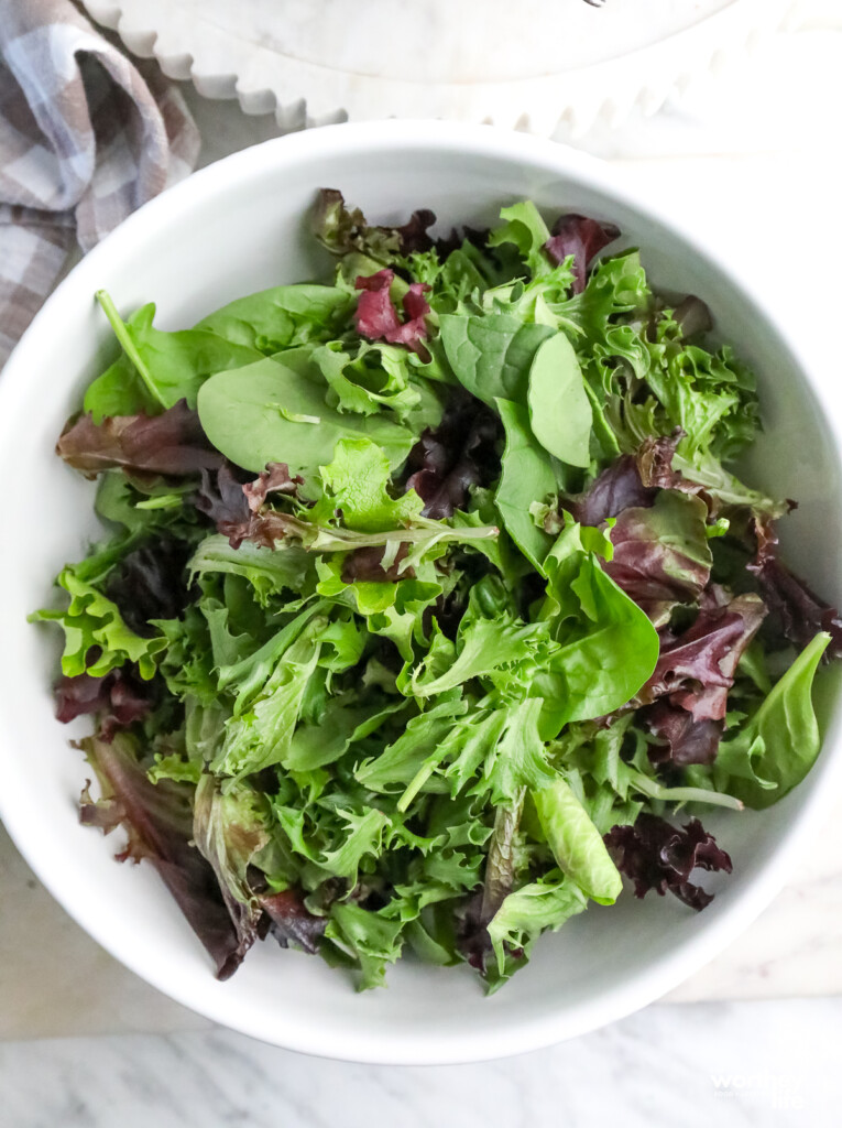 fresh greens in a white bowl
