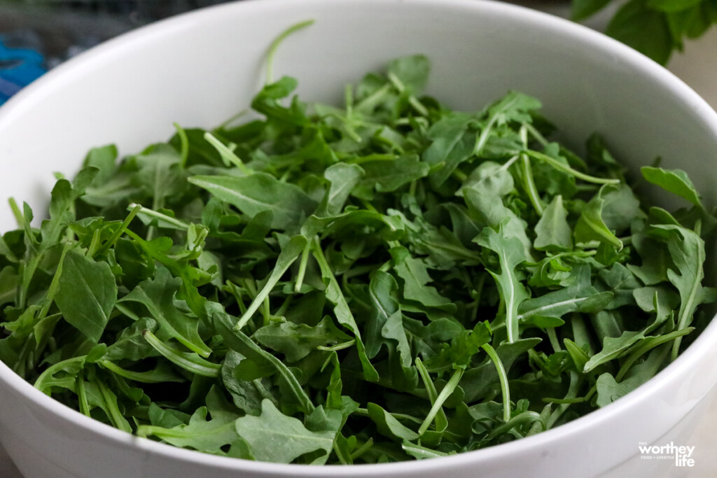 fresh arugula in a walled platter