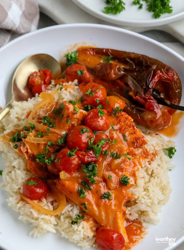 roasted tomatoes, salmon and creamy sauce over a bed of jasmine rice