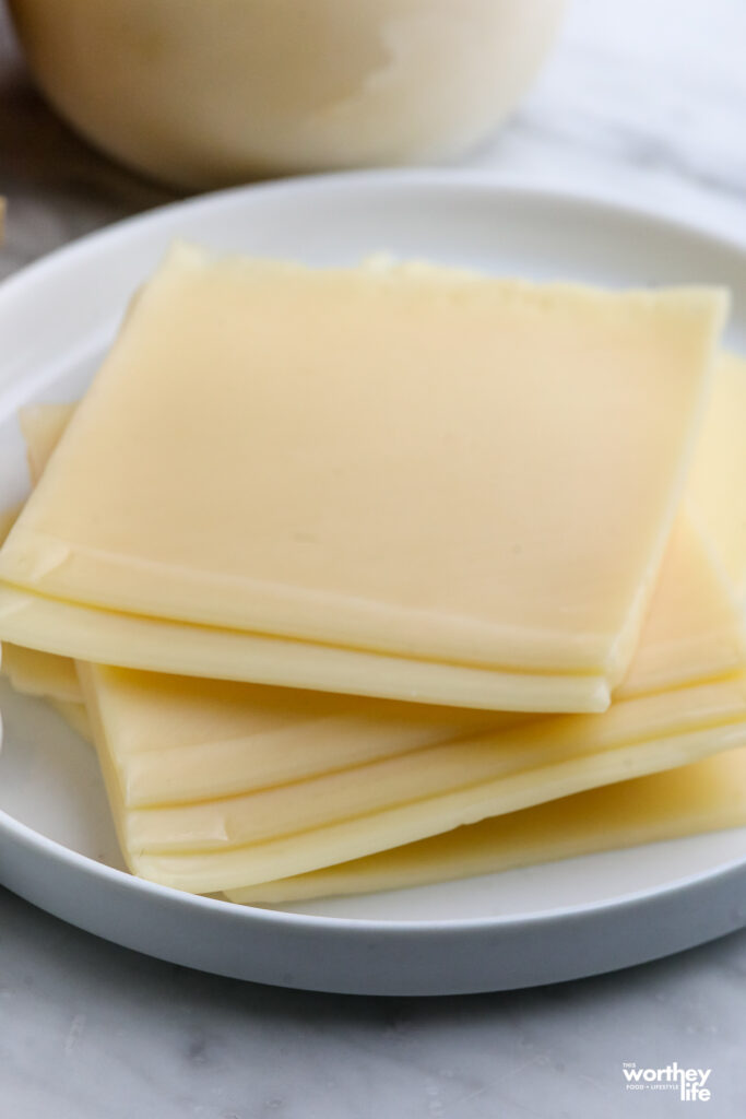 sliced Gouda on a white plate