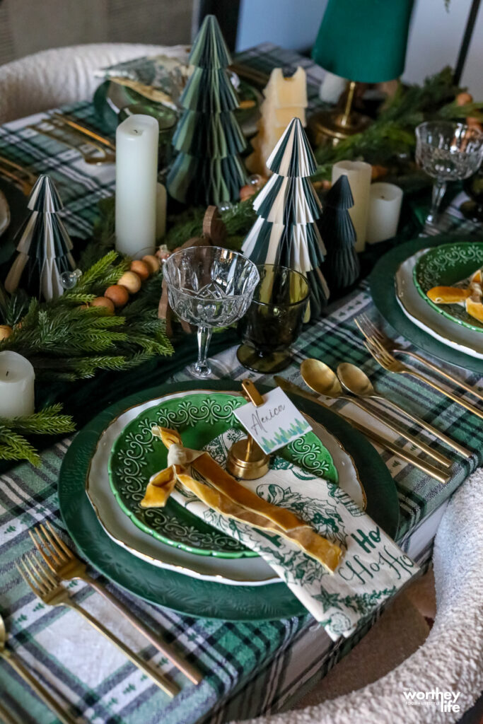 creating an evergreen tablescape with green, plaid and lots of texture