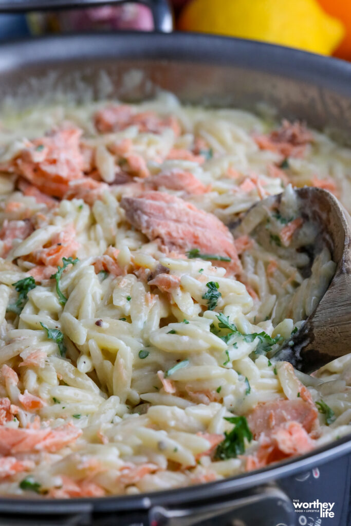 creamy orzo pasta in a skillet