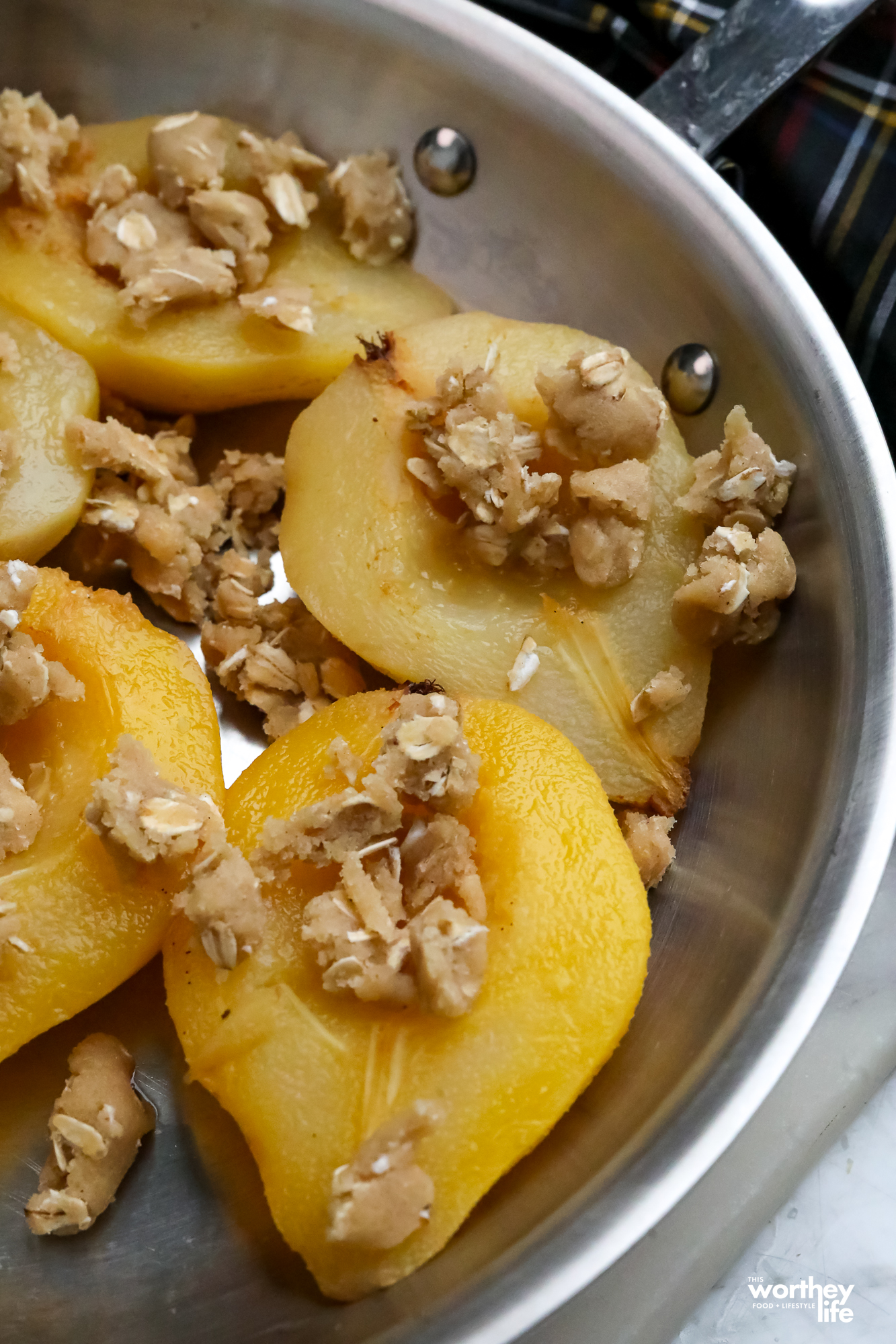 Cardamom Crisp Topping on poached pears in a skillet