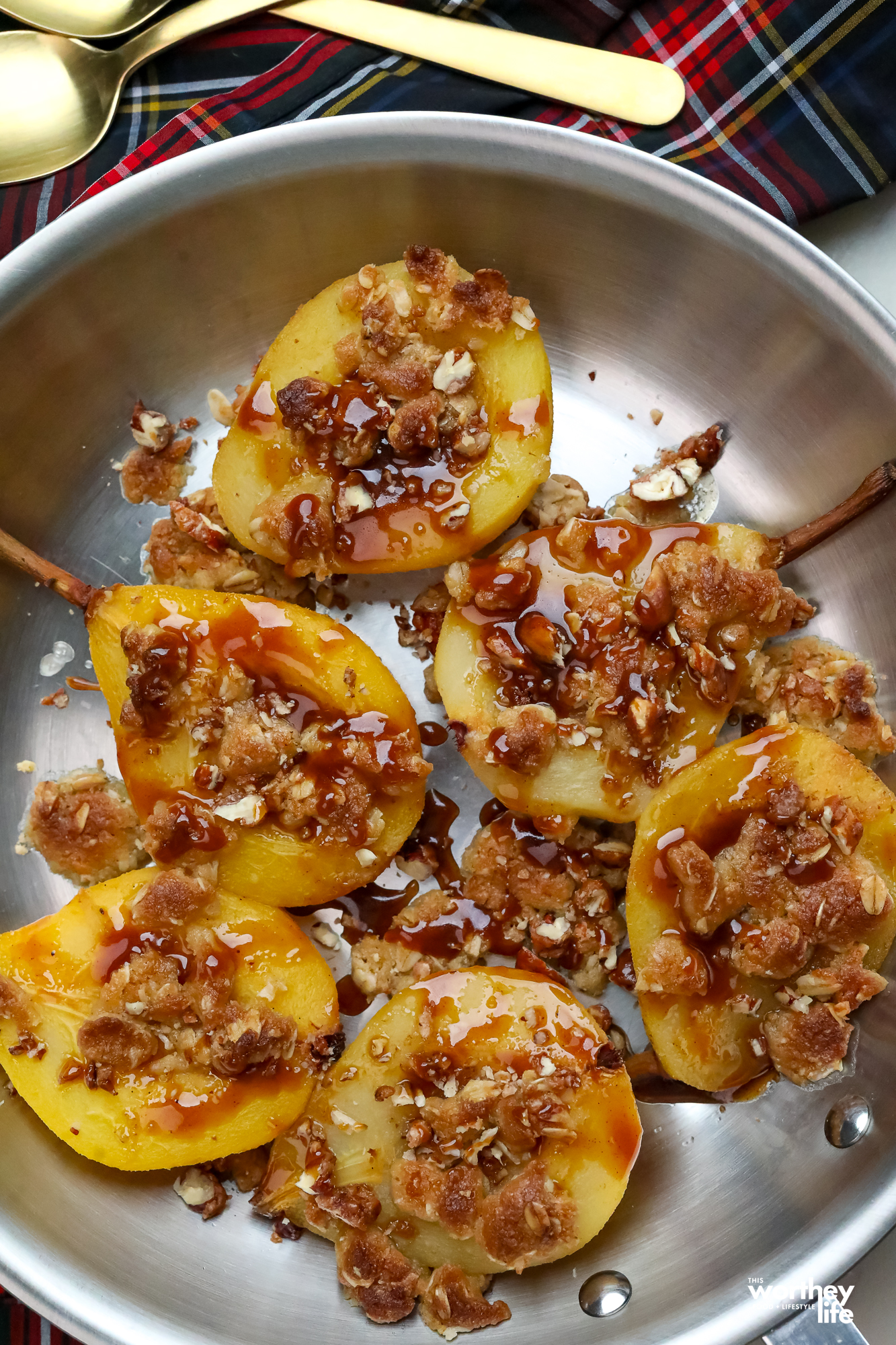 poached pears with apple cider sauce with toasted nuts